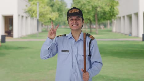 Happy-Indian-security-guard-showing-victory-sign