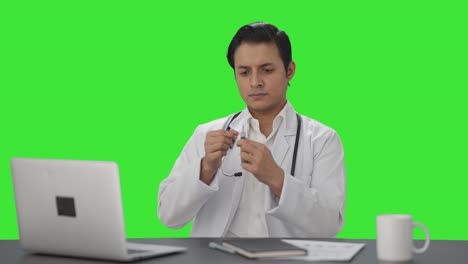 Indian-doctor-filling-the-injection-Green-screen