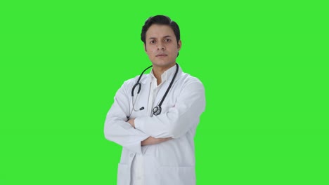 Portrait-of-Confident-Indian-doctor-standing-crossed-hands-Green-screen