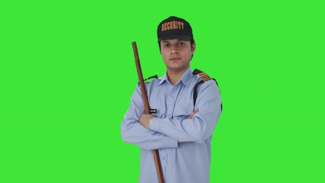 Portrait-of-Confident-security-guard-standing-crossed-hands-Green-screen