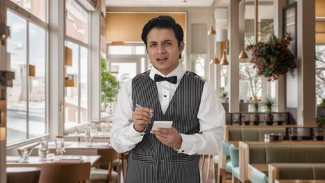 Confused-Indian-waiter-taking-order-from-customer