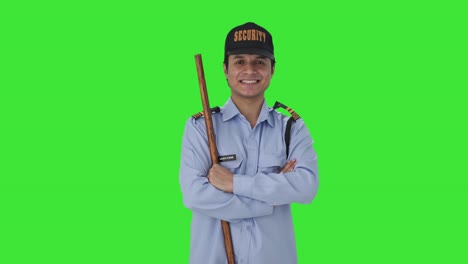Portrait-of-Happy-Indian-security-guard-Green-screen