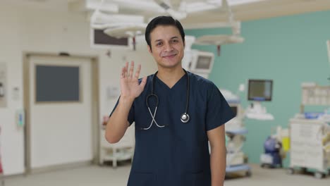 Happy-Indian-doctor-waving-Hi-to-the-camera