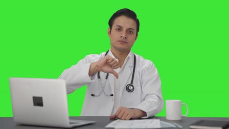 Disappointed-Indian-doctor-showing-thumbs-down-Green-screen