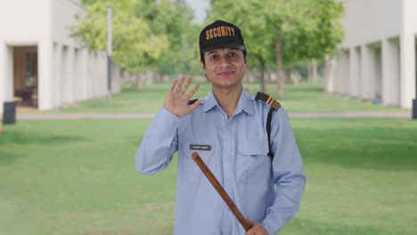Happy-Indian-security-guard-waving-Hi-to-the-camera