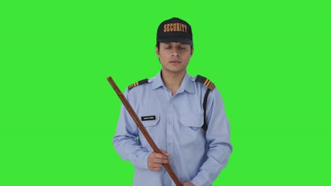 Indian-security-guard-listening-to-someone-Green-screen