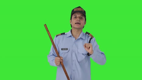 Indian-security-guard-telling-directions-to-someone-Green-screen