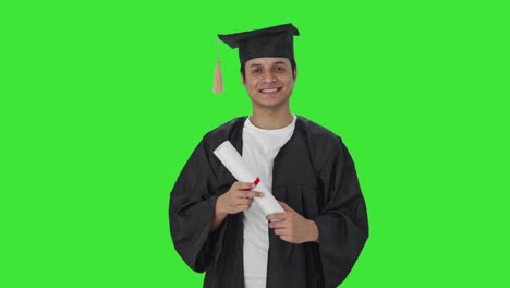 Happy-Indian-college-student-standing-with-degree-Green-screen