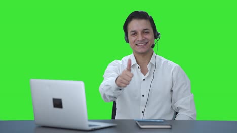 Happy-Indian-call-center-employee-showing-thumbs-up-Green-screen