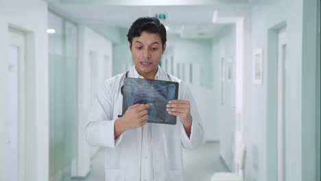 Indian-doctor-explaining-X-ray-report-to-patient