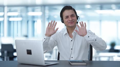 Happy-Indian-call-center-employee-waving-hello