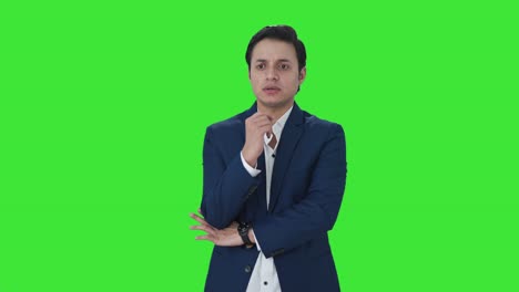 Stressed-Indian-businessman-thinking-about-something-Green-screen