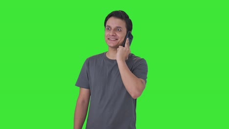 Happy-Indian-man-talking-on-call-Green-screen