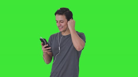 Happy-Indian-man-listening-to-music-and-enjoying-Green-screen