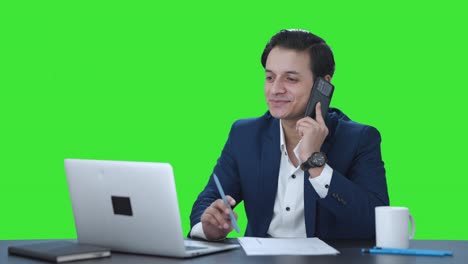 Happy-Indian-manager-talking-on-phone-Green-screen
