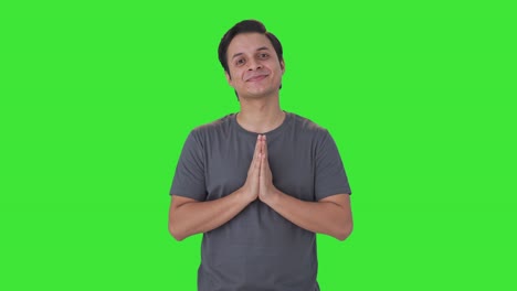 Happy-Indian-man-doing-Namaste-and-greetings-Green-screen