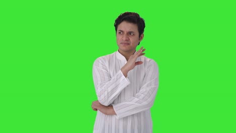 Indian-man-smelling-something-bad-Green-screen