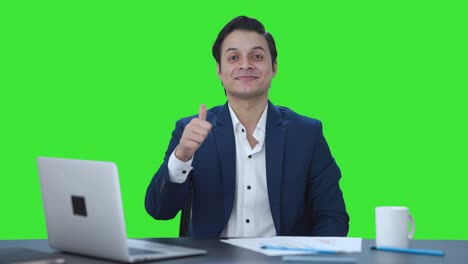 Happy-Indian-businessman-doing-Thumbs-up-Green-screen