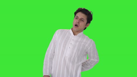 Sick-Indian-man-suffering-from-back-pain-Green-screen