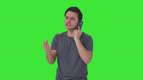 Angry-Indian-man-talking-on-call-Green-screen