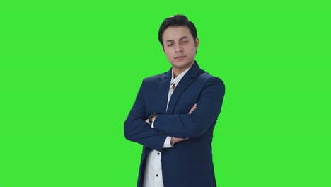 Portrait-of-Confident-Indian-businessman-standing-crossed-hands-Green-screen