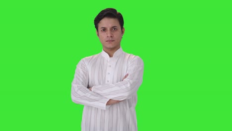 Confident-Indian-man-standing-crossed-hands-side-angle-Green-screen