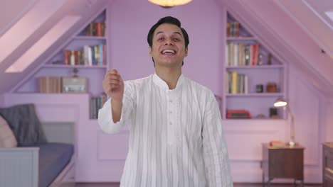 Happy-Indian-man-laughing-on-someone