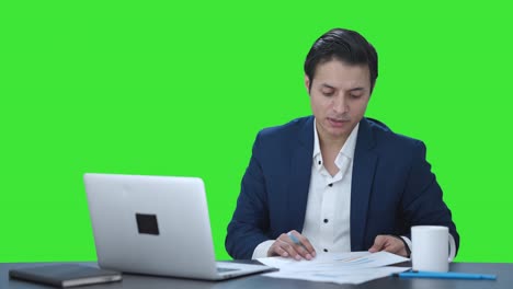 Indian-manager-talking-on-video-call-Green-screen