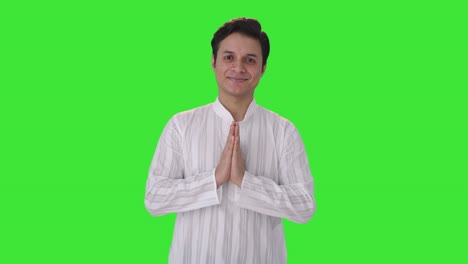 Young-Indian-man-doing-Namaste-Green-screen