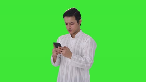 Angry-Indian-man-chatting-with-someone-Green-screen
