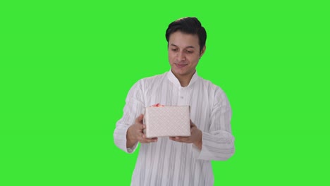 Happy-Indian-man-receiving-a-gift-Green-screen