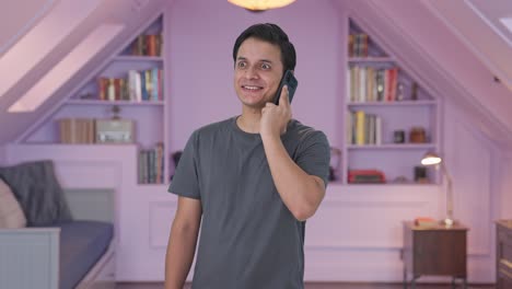 Happy-Indian-man-talking-on-call