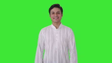 Cute-Indian-man-smiling-in-kurta-pajama-Green-screen