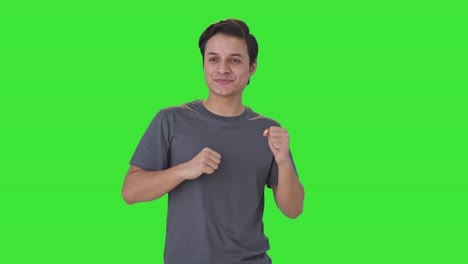 Happy-Indian-man-grooving-at-home-on-music-Green-screen