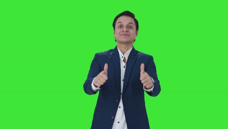 Happy-Indian-businessman-showing-thumbs-up-Green-screen