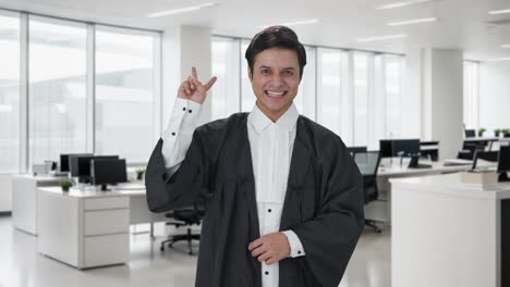 Happy-Indian-lawyer-showing-victory-sign