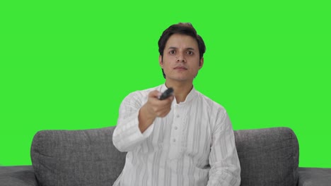 Indian-man-trying-to-fix-TV-remote-Green-screen
