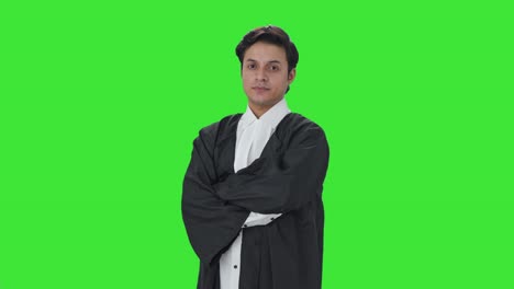 Portrait-of-confident-Indian-lawyer-standing-crossed-hands-Green-screen