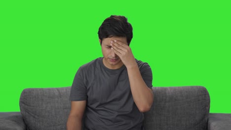 Indian-man-taking-medicine-in-headache-Green-screen