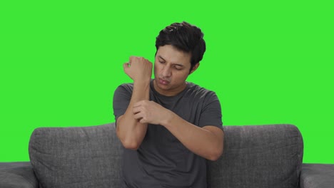 Indian-man-removing-the-bandage-from-hand-Green-screen