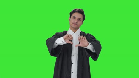 Disappointed-Indian-lawyer-showing-thumbs-down-Green-screen