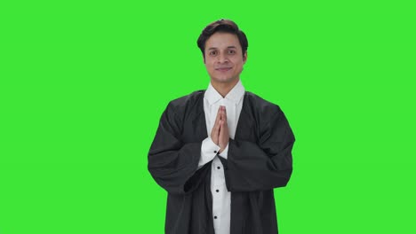 Happy-Indian-lawyer-doing-Namaste-and-greetings-Green-screen