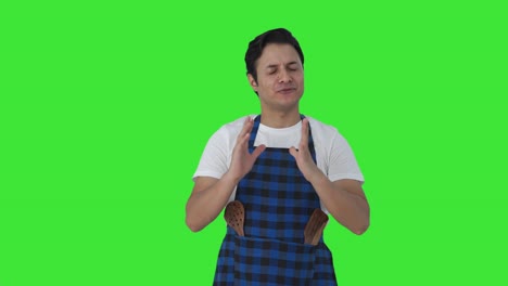 Happy-Indian-cook-talking-to-someone-Green-screen