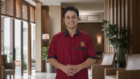 Happy-Indian-house-keeper-smiling-to-the-camera