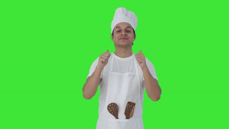 Happy-Indian-professional-chef-showing-thumbs-up-Green-screen