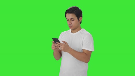 Indian-man-chatting-on-phone-Green-screen