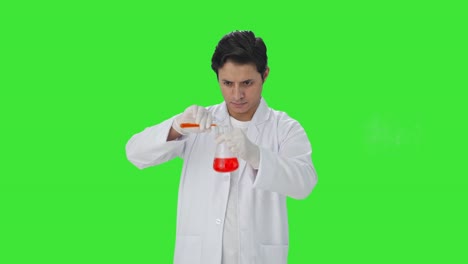 Indian-scientist-mixing-chemicals-for-experiment-Green-screen