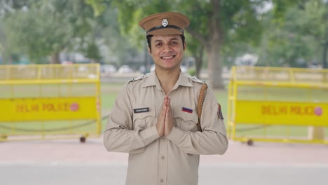 Happy-Indian-police-officer-doing-Namaste
