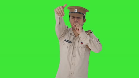 Angry-Indian-police-officer-calling-someone-using-whistle-Green-screen