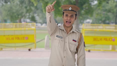 Angry-Indian-police-office-pointing-and-calling-someone